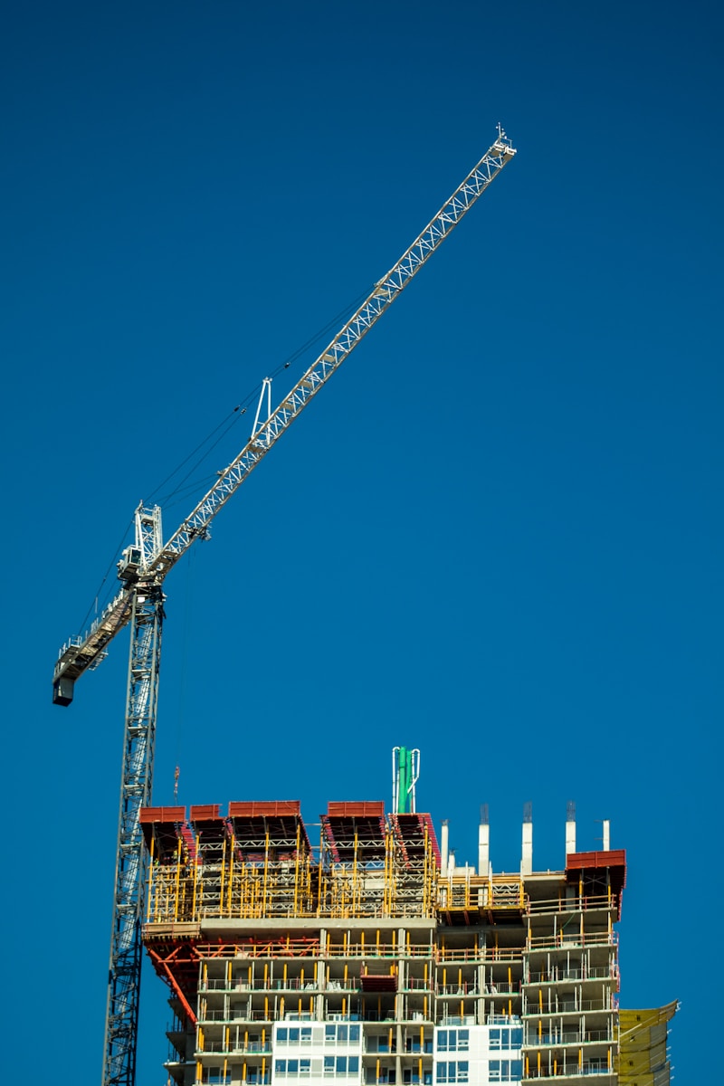 crane under blue sky during daytime